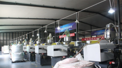 Wood flooring being precision cut in factory
